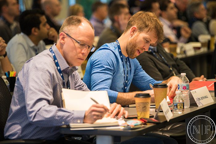 men at a Scheduling Institute event